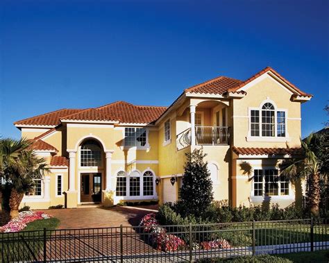 yellow house with red metal roof|yellow stucco house colors.